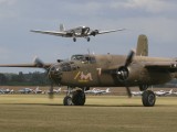 FL2006_076 - the DOB B-25 taxing back to the apron with the JU52 takling off in the background